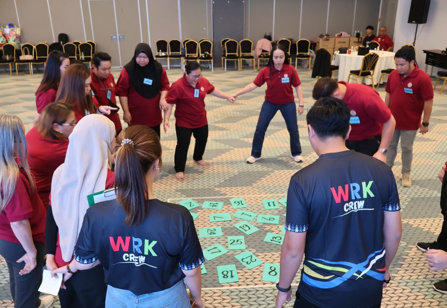 Team building in Sarawak with WRK participants collaborating in an experiential activity